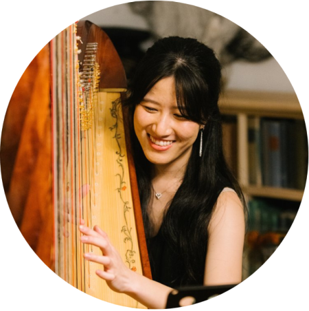 harpist Tiffany Wu playing on a harp